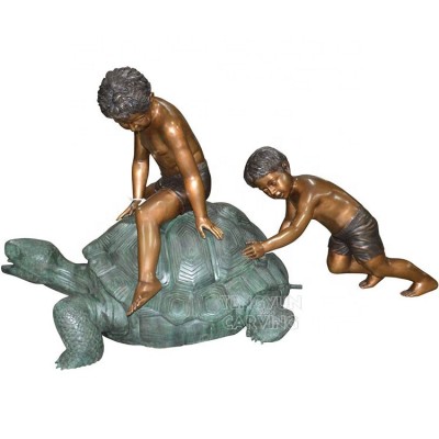 Outdoor one boy sitting on turtle large bronze tortoise with boys playing